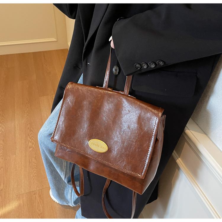 

Korean bag women s 2025 new retro oil wax leather college student class backpack foreign style portable backpack