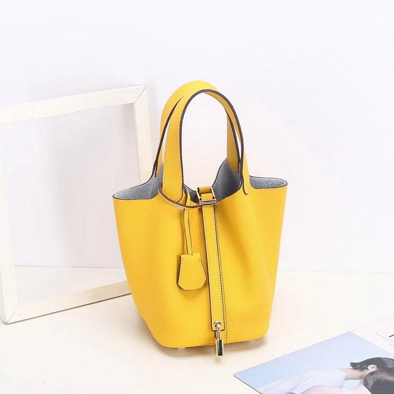 2026 new first-layer lychee pattern leather bucket bag European and American brand fashion gold buckle cowhide vegetable basket women's bag