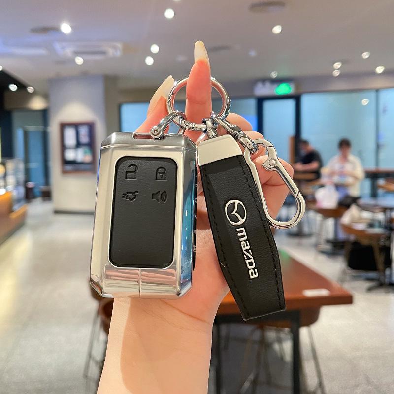 Kuooo: Durable, Fully Enclosed Cover with Buckle for Mazda EZ6 Key Fobs and EZ60 Car Remotes.