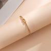 Vergoldetes geknotetes Schlangenknochenarmband - Modeschmuck aus rundkettigem Titanstahl