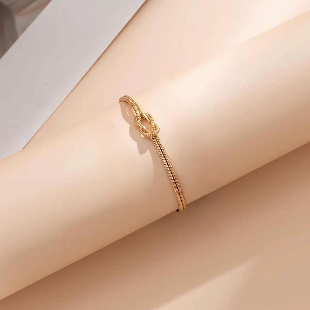 Vergoldetes geknotetes Schlangenknochenarmband - Modeschmuck aus rundkettigem Titanstahl