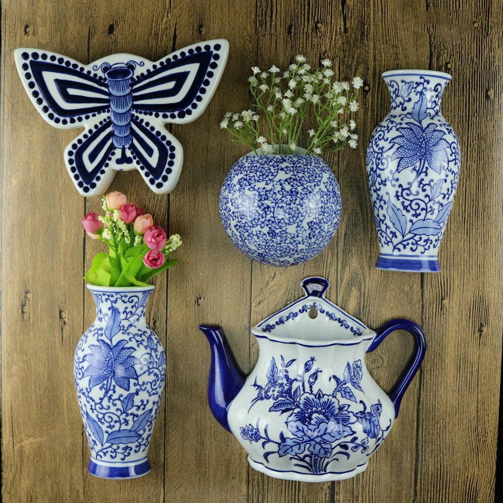 Hand-Painted Blue and White Ceramic Wall Vase with Floral and Bird Design