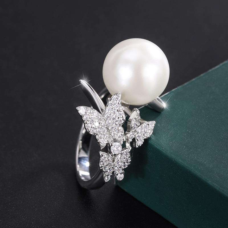 

Ювелирные изделия Медное основание Позолота Инкрустированные белые бусины Бабочка Ручная работа Бриллиантовый набор 14 мм 12 мм