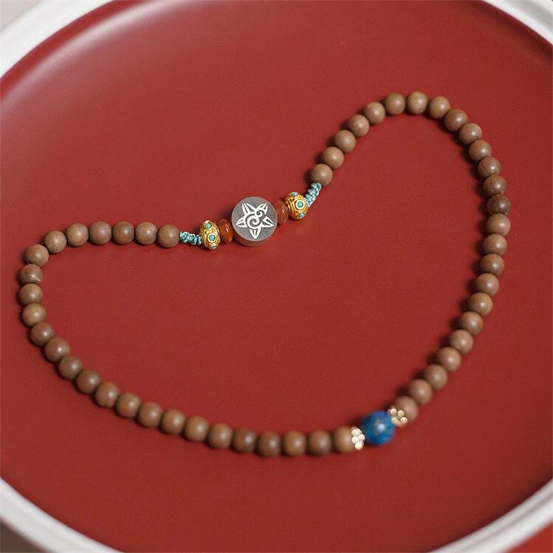 

Indian Sandalwood Sun Moon Stars Bracelet with Lacquer Beads and Gold-Plated Dragonfly Eye Pure Natural