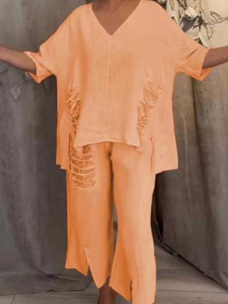 

Женский топ с V-образным вырезом, свободного кроя, с короткими рукавами, серебристыми пайетками и асимметричным подолом, плюс подходящие укороченные брюки с пайетками по бокам и разрезом по низу. 2XL