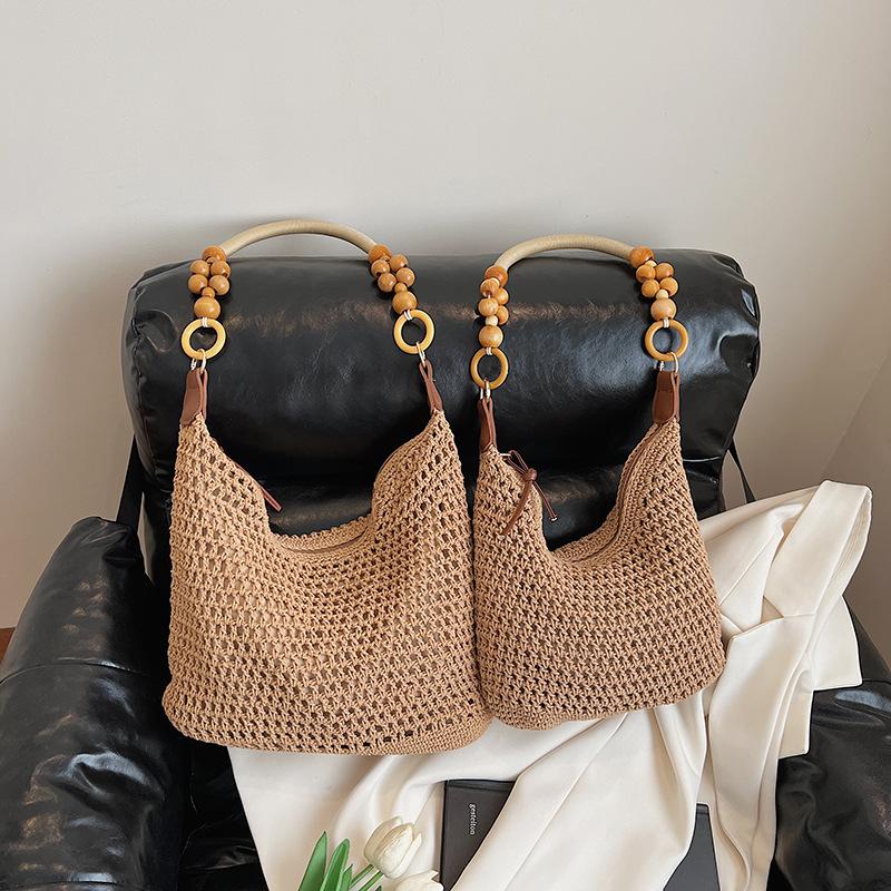 Holiday style woven bag women's 2025 new knitted hollow shoulder bag fashionable large-capacity messenger bag beach bag