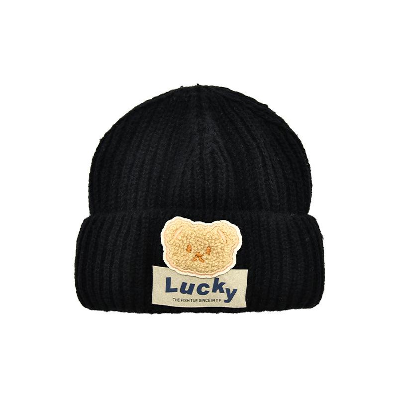 

Осень и зима новая детская мультяшная нашивка с медведем однотонная гофрированная вязаная шапка для мальчиков и девочек зарубежная универсальная шерстяная теплая шапка average size (56-58CM) чёрный