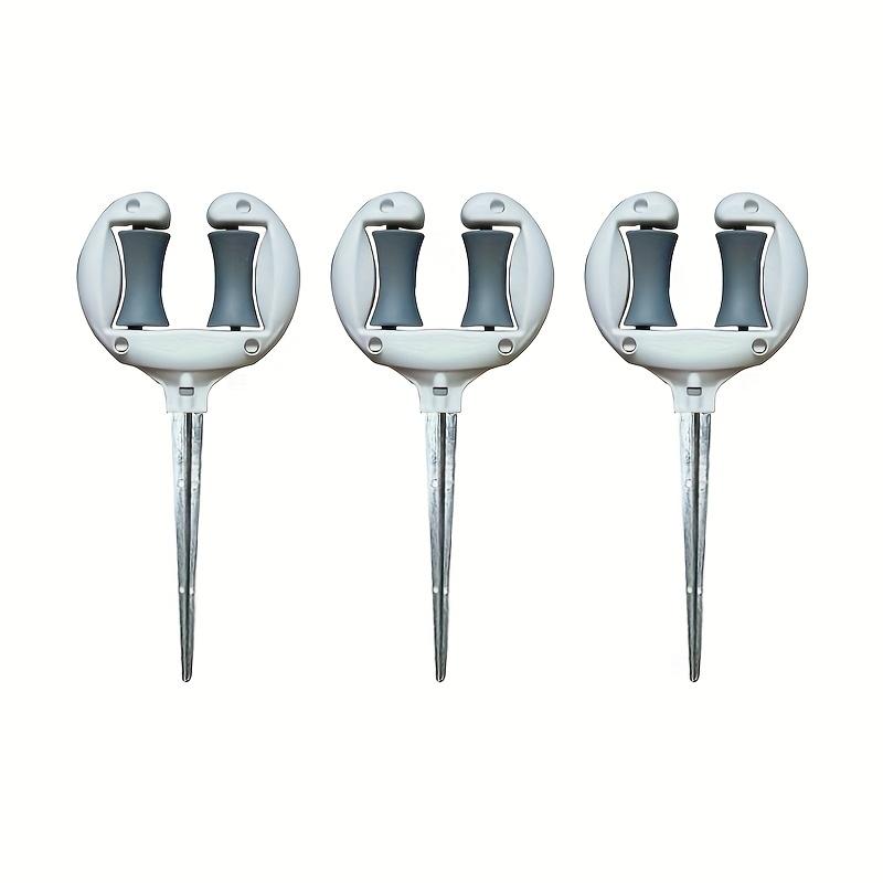 

3 штуки или три штуки прочных направляющих для садового шланга оранжевого и серого цвета, с надежным железным основанием. Просто настроить