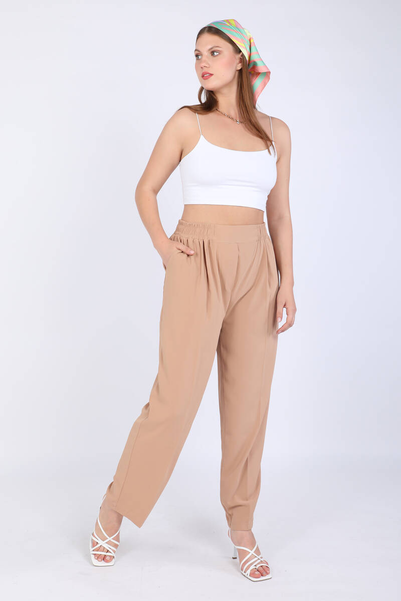 

Женские брюки из эластичной ткани на талии Бежевые