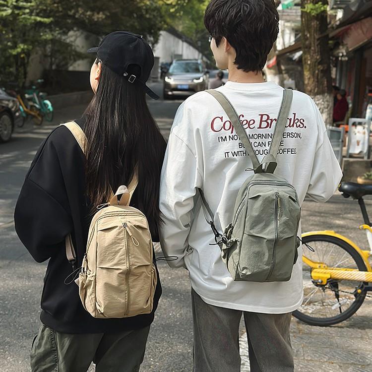 School bag Solid color outdoor mountaineering waterproof pleated backpack Lightweight leisure travel messenger bag Niche versatile simple breast bag