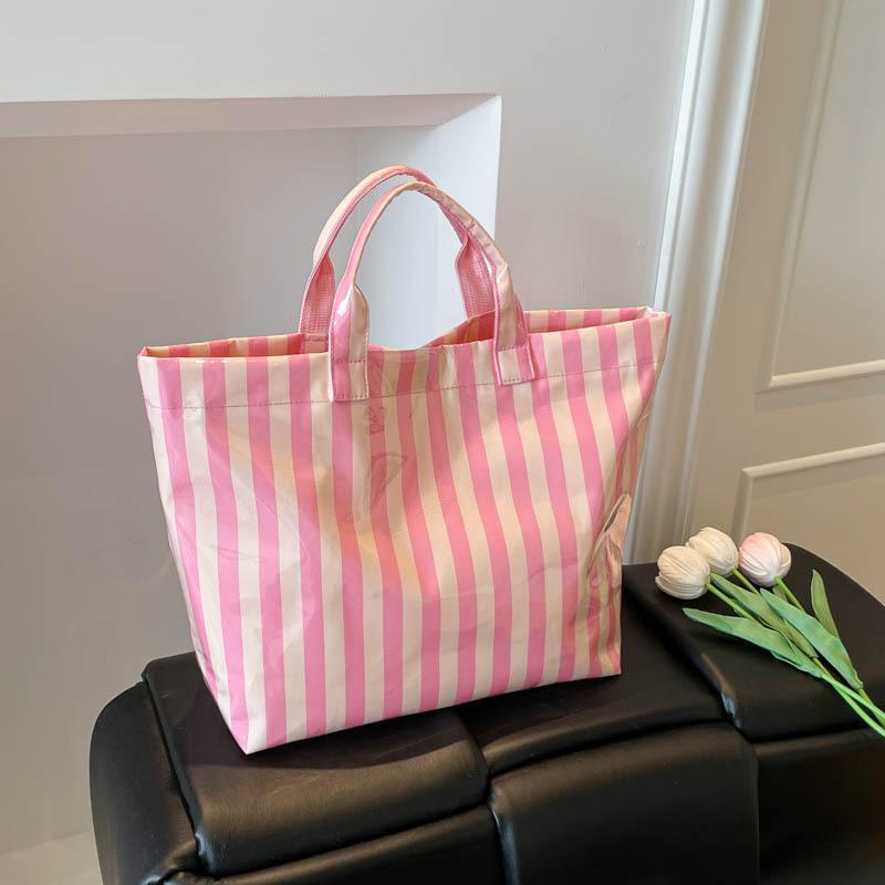 This Water-Resistant Pvc Tote Bag Features A Pink And Blue Striped Design, A Large Capacity, And Is Suitable For Beach Shopping,
