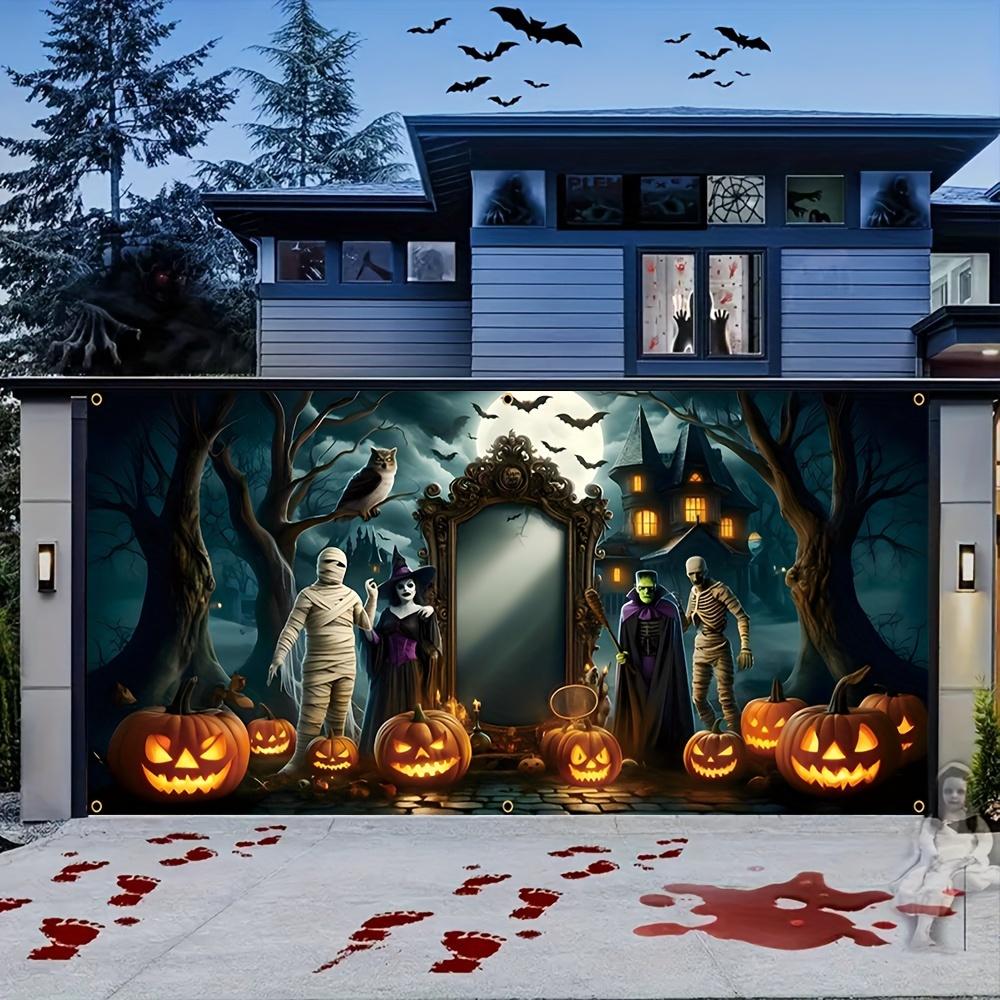 A Halloween garage door banner featuring terrifying bandages monsters witches bats pumpkins owls and dead trees