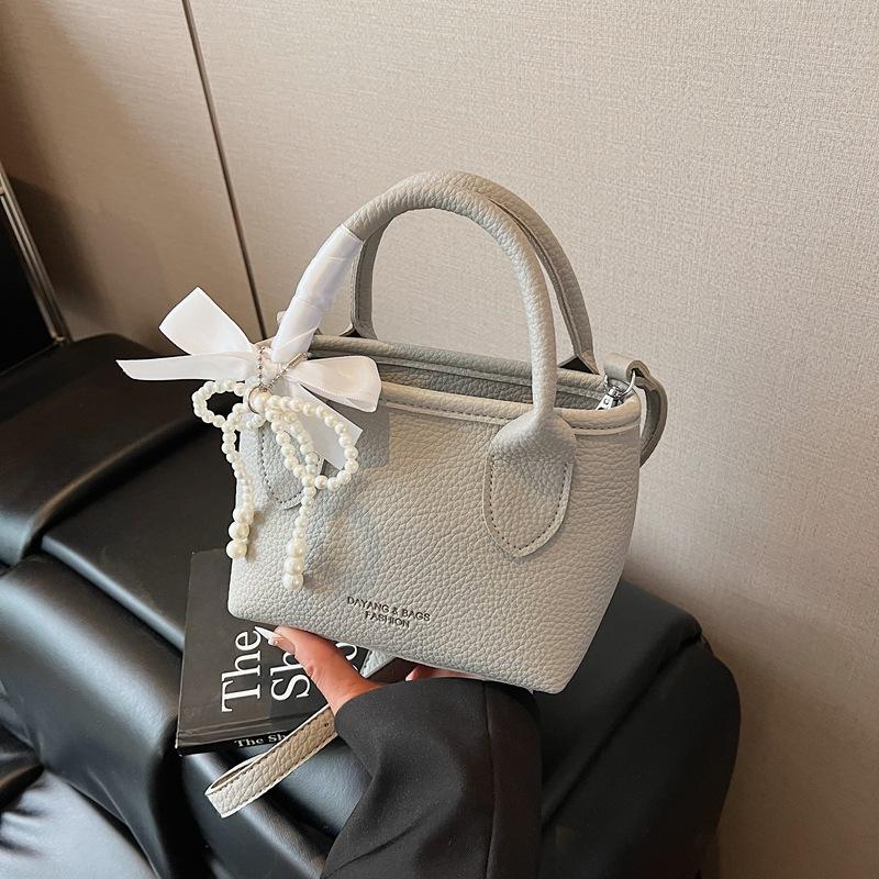 Niche design portable bucket bag women's 2025 new spring and summer bag shoulder messenger bag tide