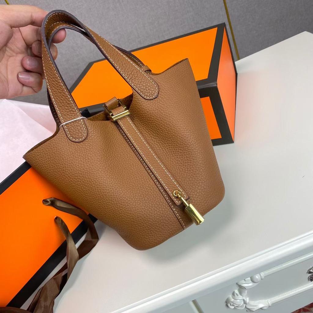 Hochwertige halbhandgefertigte Gemüsekorbtasche togo erste Schicht Rindsleder Pendlertasche echtes Leder tragbare Beuteltasche Damen 18cm