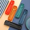 Portable Knife, Fork, Spoon and Chopstick Set for Outdoor Camping. Black Wheat Straw Tableware Set of Four Pieces.