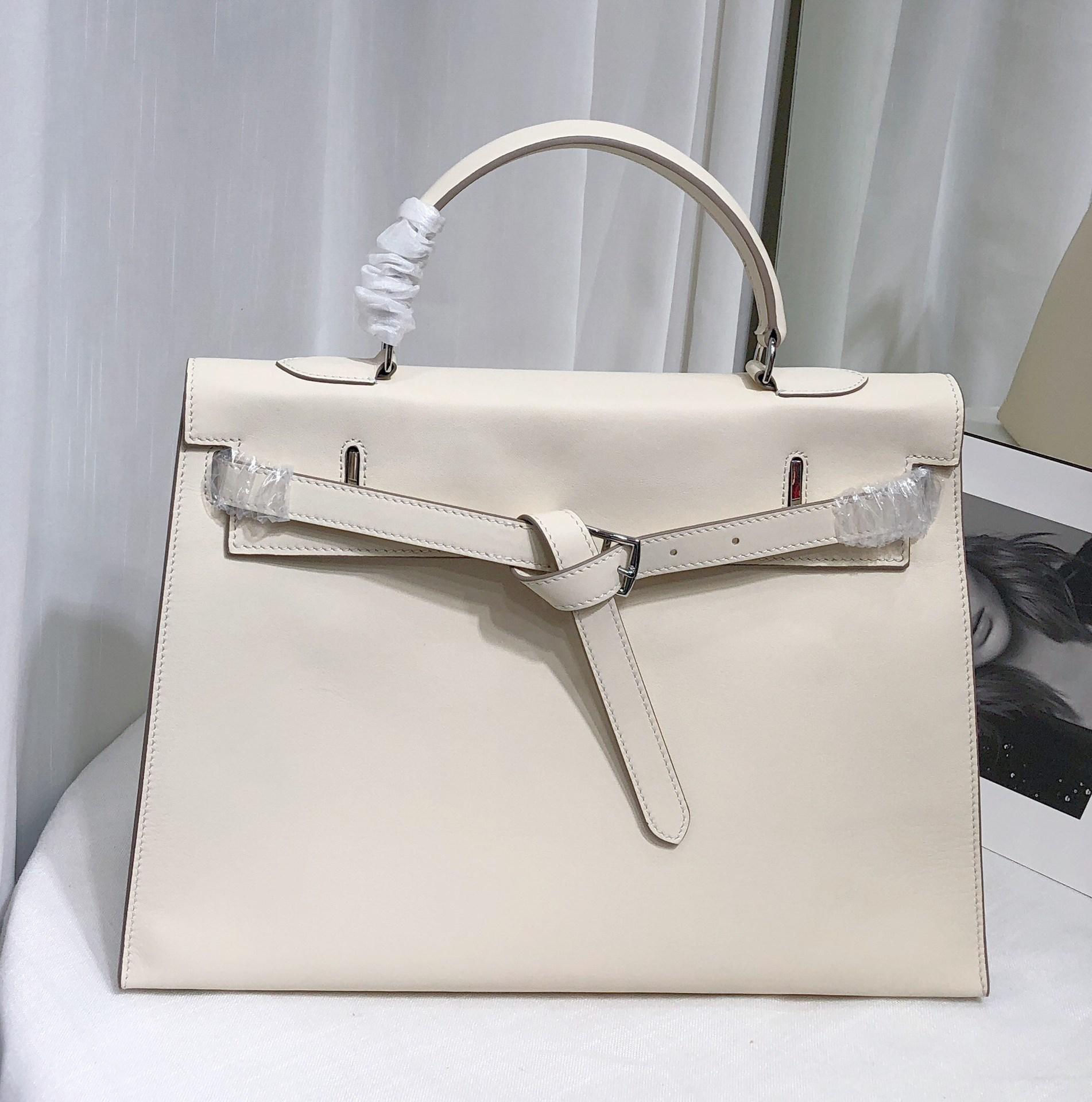 

Верхний слой Fubao Saddle кожа супермягкая кожаная складная сумка-клатч Премиум сумка через плечо для женщин 35x13x25cm белый