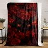 A black cat's face surrounded by vibrant red roses. for all seasons blanket lunch break throw gift