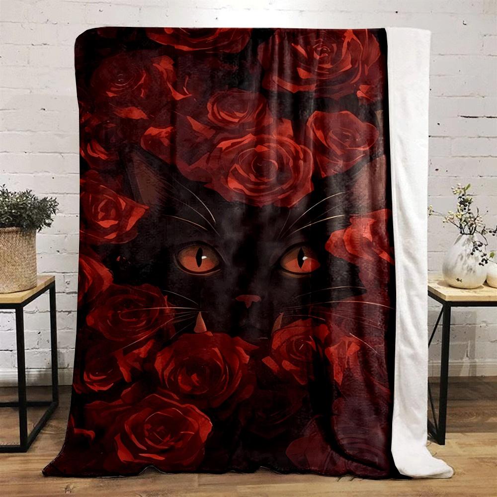 A black cat's face surrounded by vibrant red roses. for all seasons blanket lunch break throw gift
