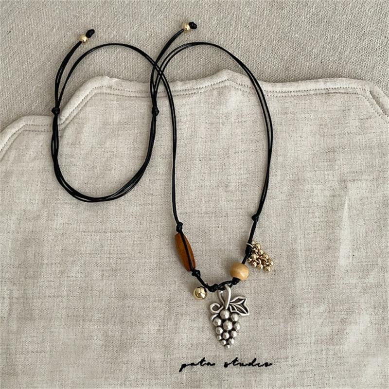 Stylish Alloy Accent Necklace With Sliding Closure Braided Cord and Natural Wood Materials