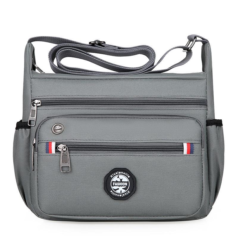 

2024 Multi-Compartment Commuter Bag: Large Capacity, Crossbody, Fashionable Shoulder Bag in Solid Colors сірий колір