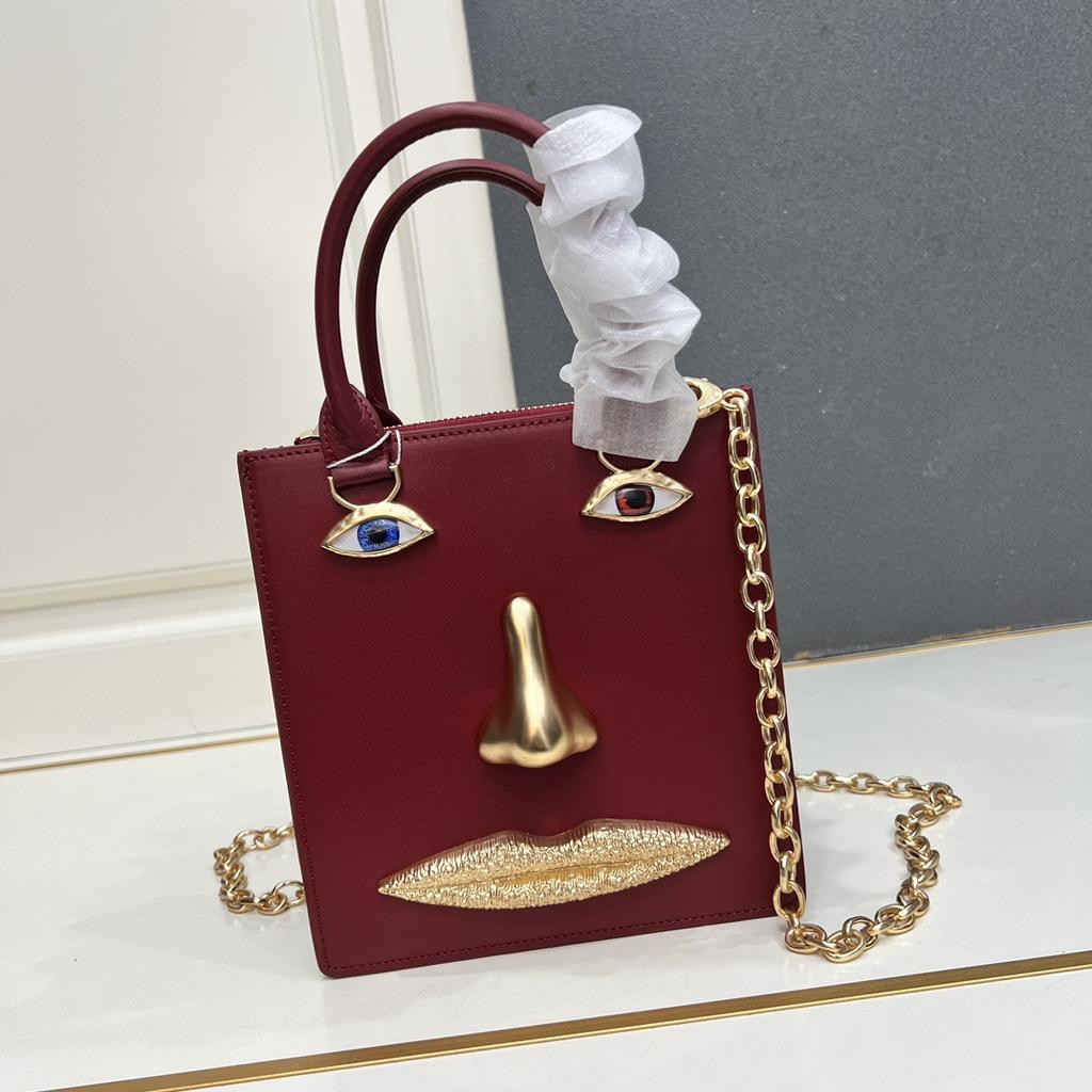 26 trendy new schiap face women's bag plain weave cowhide chain design sense hand-held tote bag