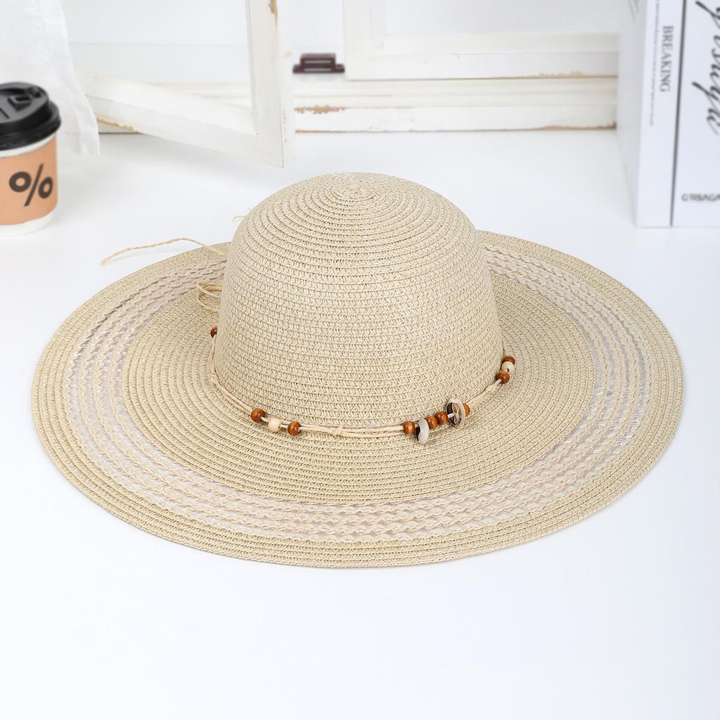 New Spring and Summer Fashion Strap Hollow Straw Hat Outdoor Casual Wind Hand-woven Sun Hat Women's Seaside Beach Hat