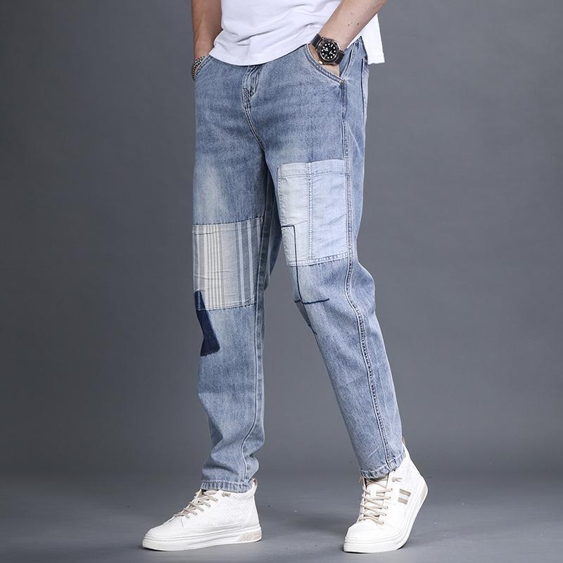 High-end heavy craft splicing tide men's spring new zip light blue jeans small leg trousers
