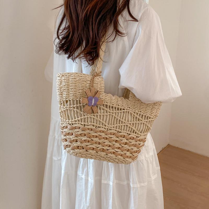 Handwoven Natural Fiber Tote Bag with Braided Handles and Open Weave Design