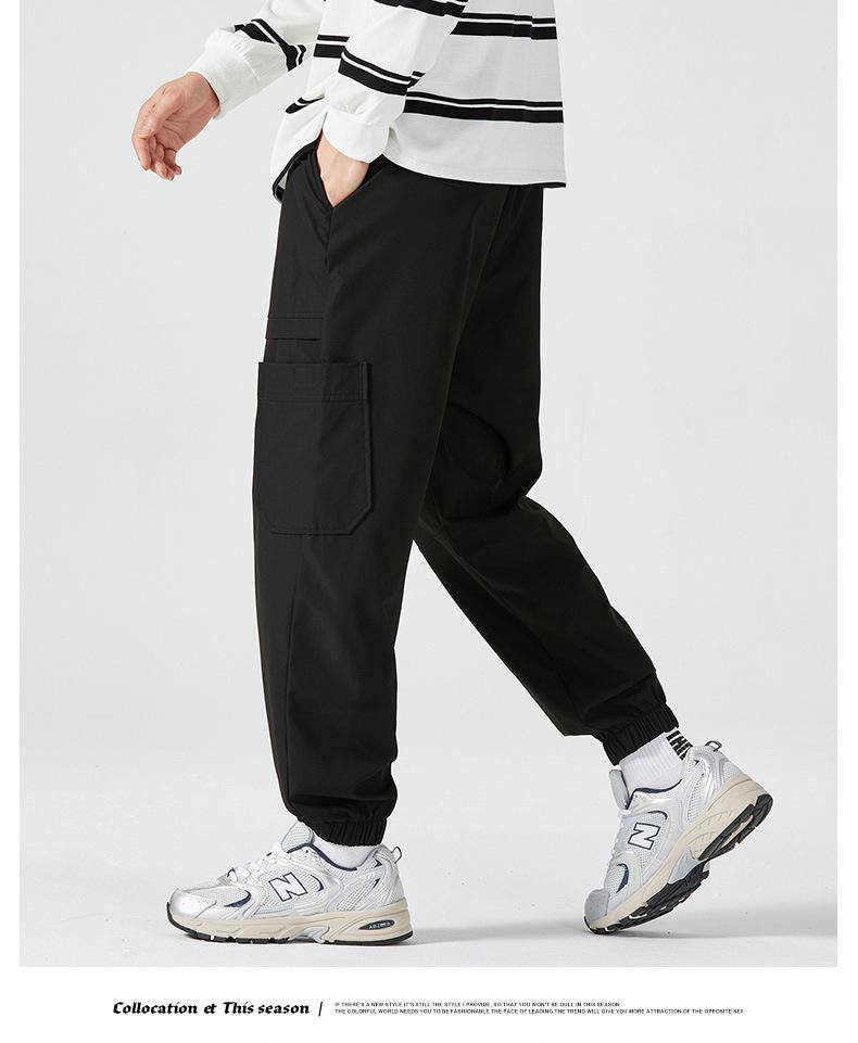 Men's American-Style Autumn Overalls: Fashionable, Casual, Versatile Nine-Point Pants with Loose Cuffs and Multi-Pocket Design.