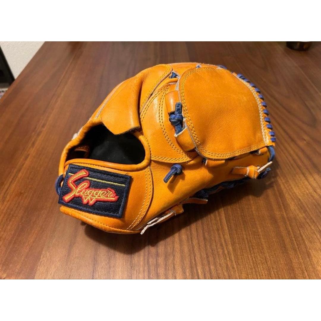 Used Slugger hard glove special order orange