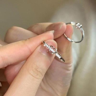 Women's Adjustable Love Zircon Ring: Simple Hollow Heart Design with Diamond Accents, Ideal for Fashion-Forward Girlfriend's Index Finger.