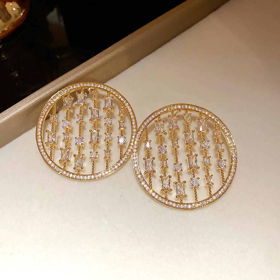 

Silver needle zircon hollow round stud earrings European and American fashion exquisite earrings light luxury high sense earrings design sense niche