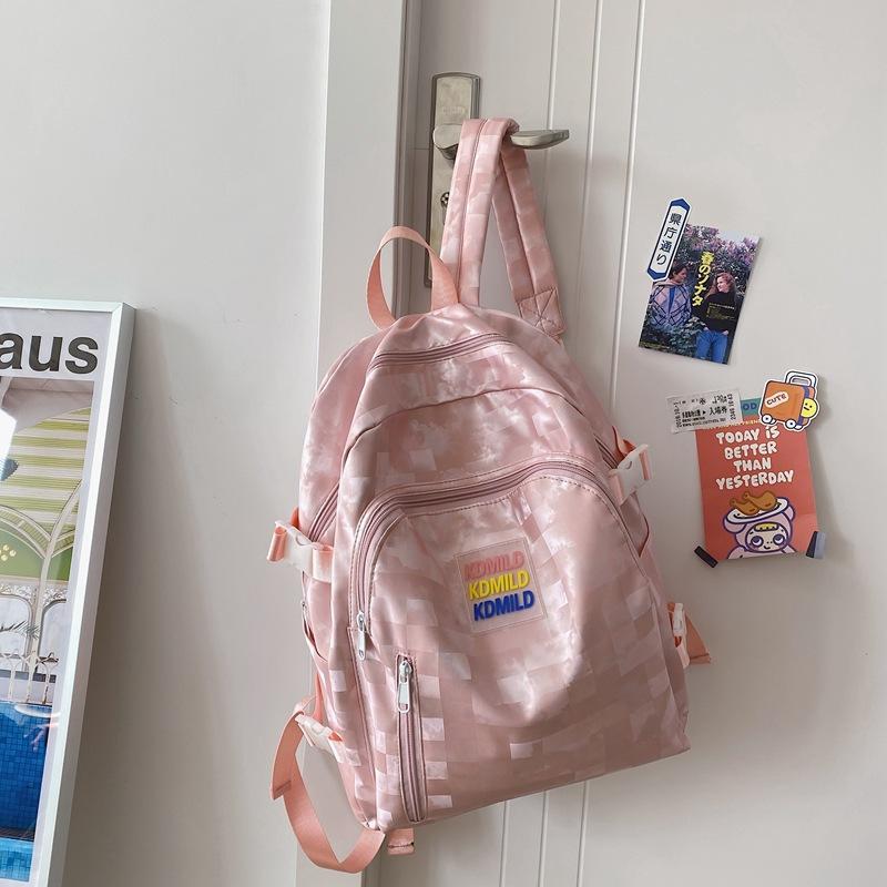 

Japanese leisure junior high school students tide brand backpack niche schoolbag male and female college students anti-splashing checkerboard backpack розовый