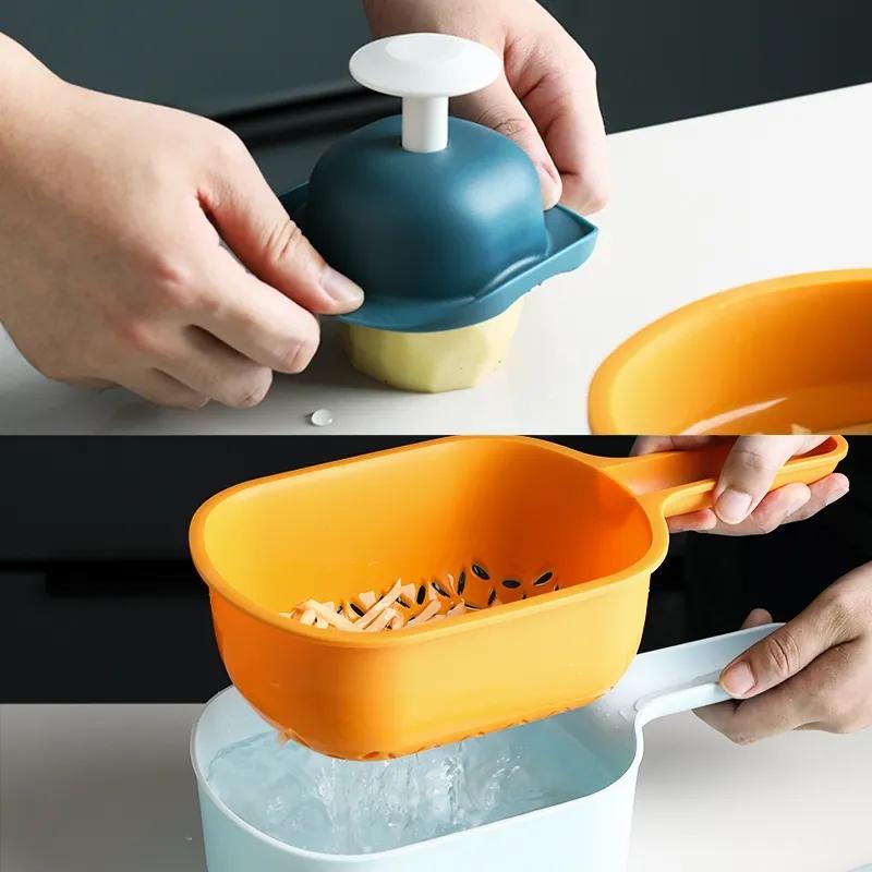 Forniture da cucina Tagliaverdure multifunzione Grattugia per artefatti Patatine fritte Tritatutto domestico Cestello di scarico Macchina affettatrice per pomodori e carote Tritatutto