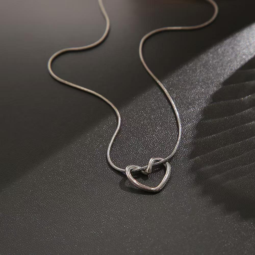 Women's Heart Pendant Clavicle Necklace - Simple, Hollow, Heart-Shaped Design