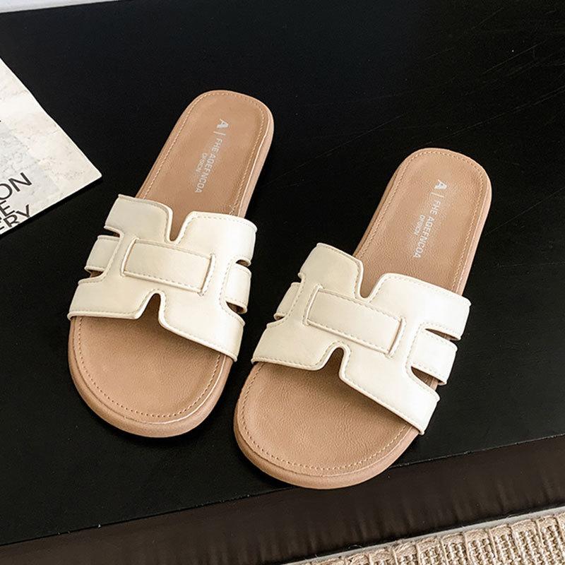 French one-word slippers for women's outer wear 2025 new summer seaside beach beautiful flat-bottomed out flat-bottomed cool slippers