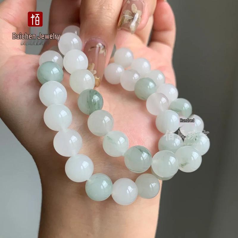 Golden Silk Jade Bracelet: Women's Xinjiang Tianshan Green Jade with Floating Flower Design and Barrel Beads.