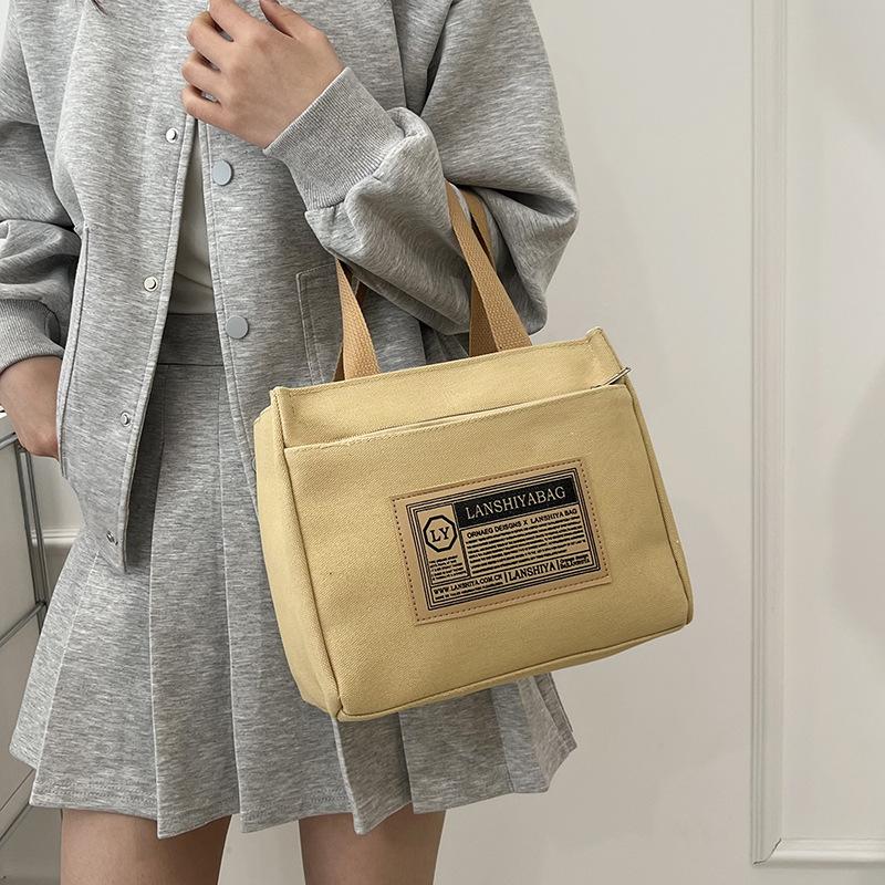 New canvas bag, multi-functional, fashionable and versatile, simple make-up bag, niche design, student class messenger bag