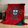 A red background with a central badge featuring a shield and cross design. for all seasons blanket lunch break throw gift