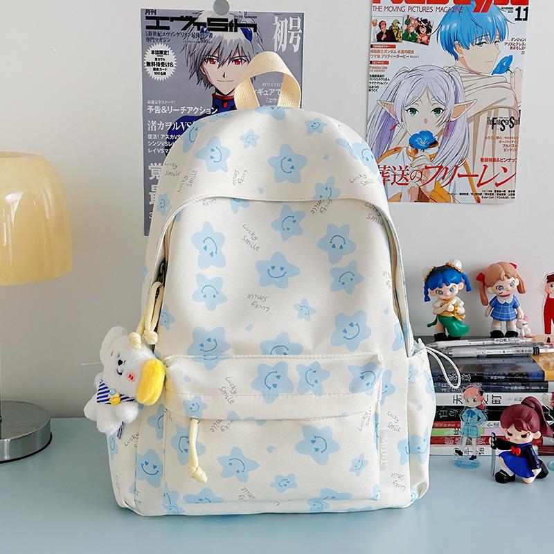 Nowy tornister jest wysokiej jakości, świeży, słodki i uroczy, a plecak w gwiazdki to lekki plecak podróżny dla uczniów gimnazjum.