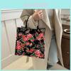 Modische Canvas-Tragetasche mit Blumendruck Trendige Handtasche im Streetstyle in Schwarz