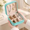 Zippered Leather-Material Jewelry Storage Case with Lid Hooks, Interior Pocket, Ring Rolls, and Removable Dividers