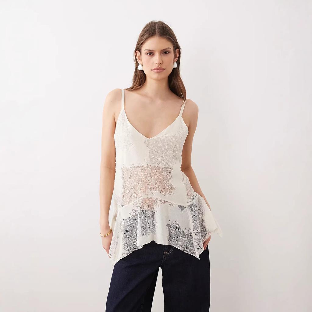 French heavy industry lace bottoming shirt women's summer irregular medium and long suspender vest hollow ruffle edge holiday top