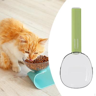 Odměrka na krmivo pro psy s klipem na sáček a lžičkou na kočky