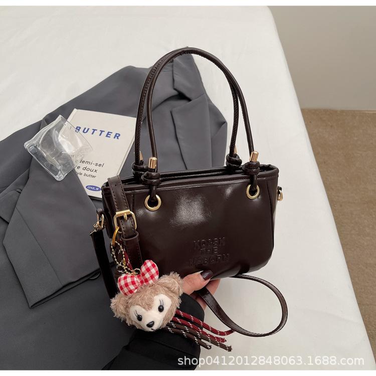 

Premium handbag handbag women s spring 2025 new versatile super fire shoulder crossbody bucket bag темно-коричневого кольору