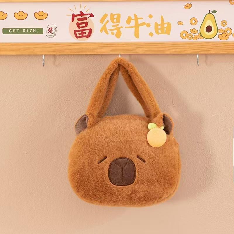 Cute new Kapibara capybara cartoon handbag plush toy Maillard girl heart grab machine doll 20cm