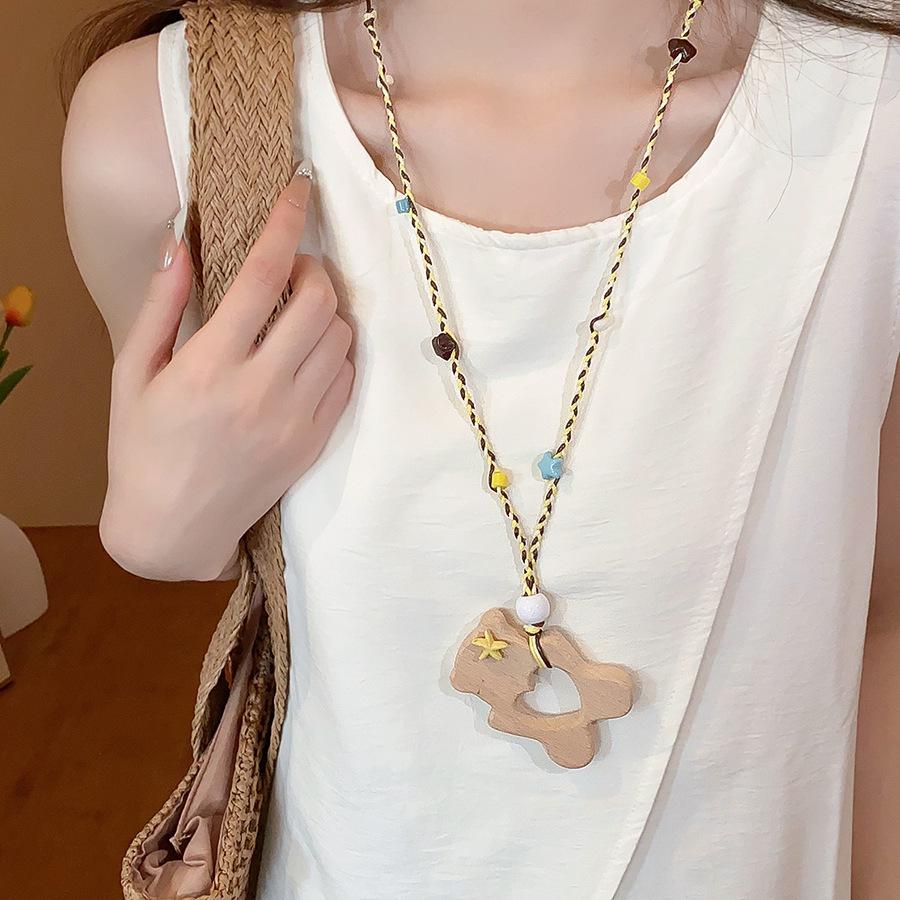 Retro Ethnic Heart Necklace: Wooden Flower Pendant Sweater Chain for Women