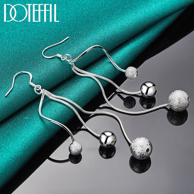 Urocze kolczyki z koralików srebrna biżuteria