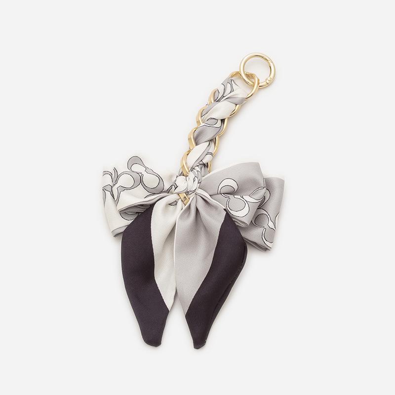 Elegant Hand-Woven Scarf Chain with Bow Decoration Pendant for Bag Strap Modification.
