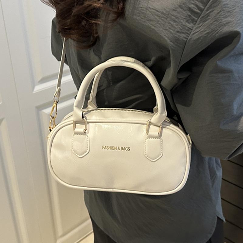 Hand carry fashion tote bag 2025 spring and summer new simple casual shoulder bag high-end trend oblique span bag